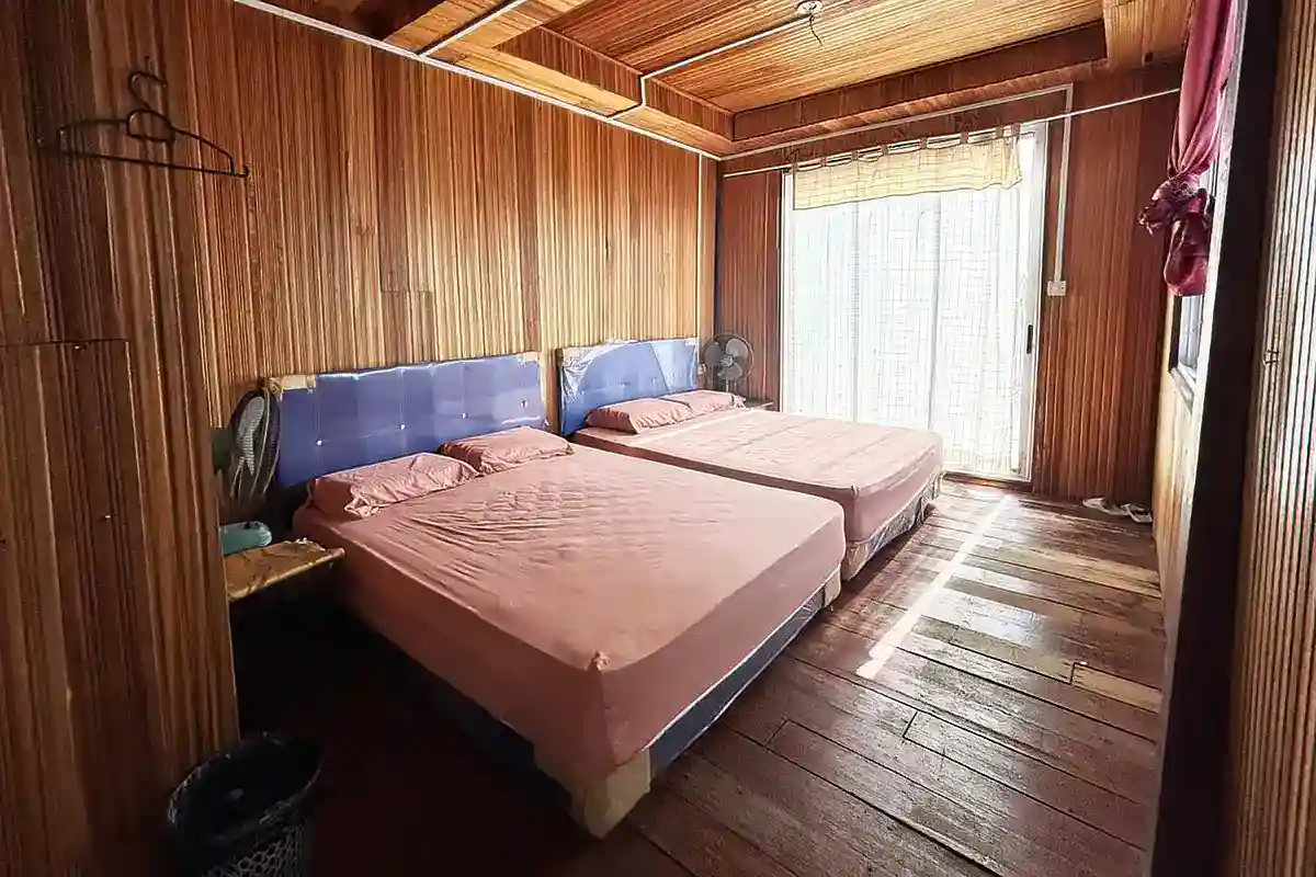 Cozy overwater bedroom built with traditional material and offering sea views