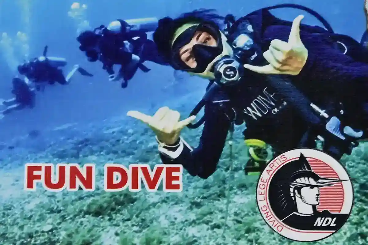 Scuba diving over pristine coral reef in the Tun Sakaran Marine Park